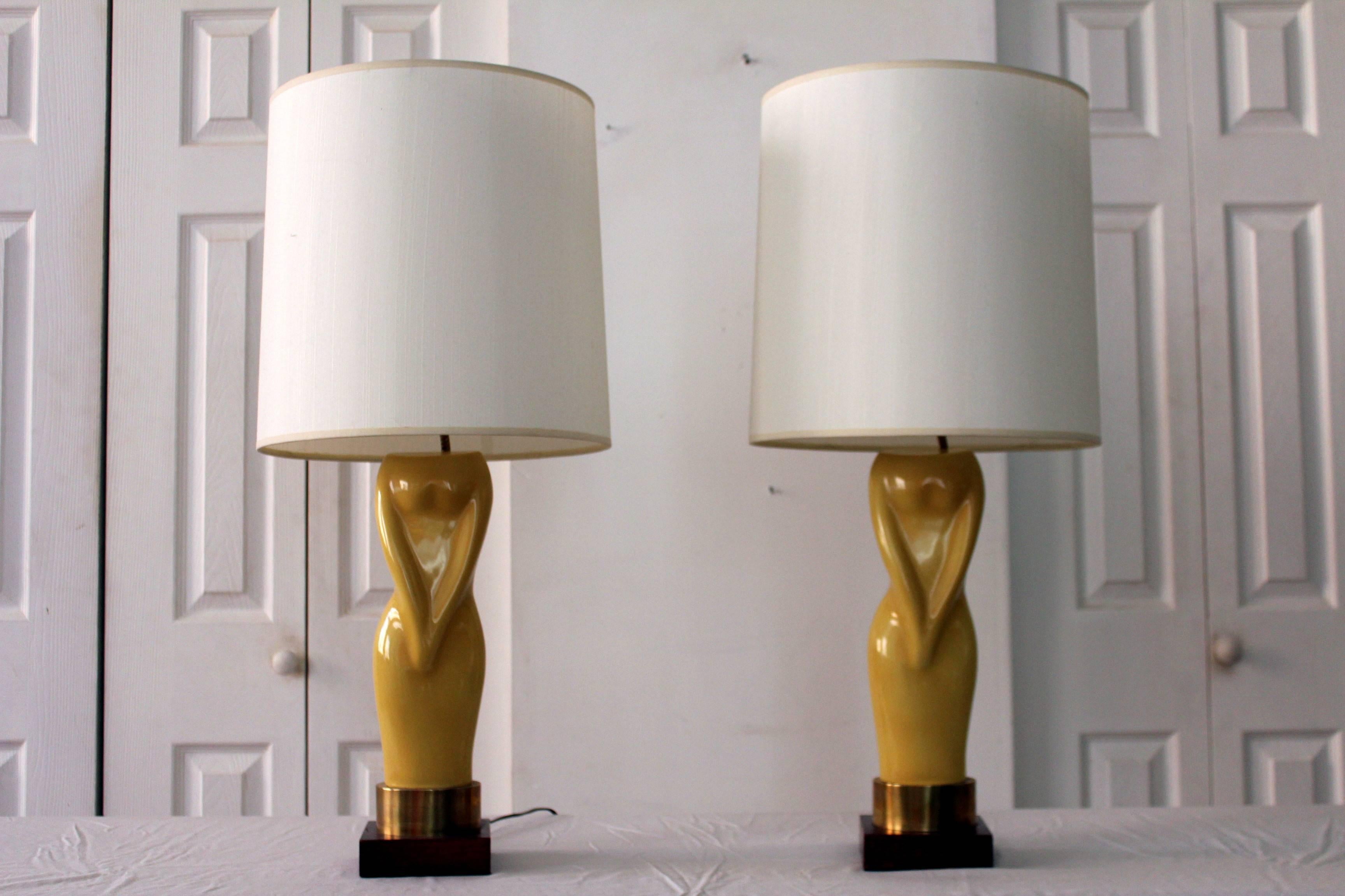 Pair of Womens Figural Yellow Lamps with White Shades In Good Condition For Sale In Chicago, IL