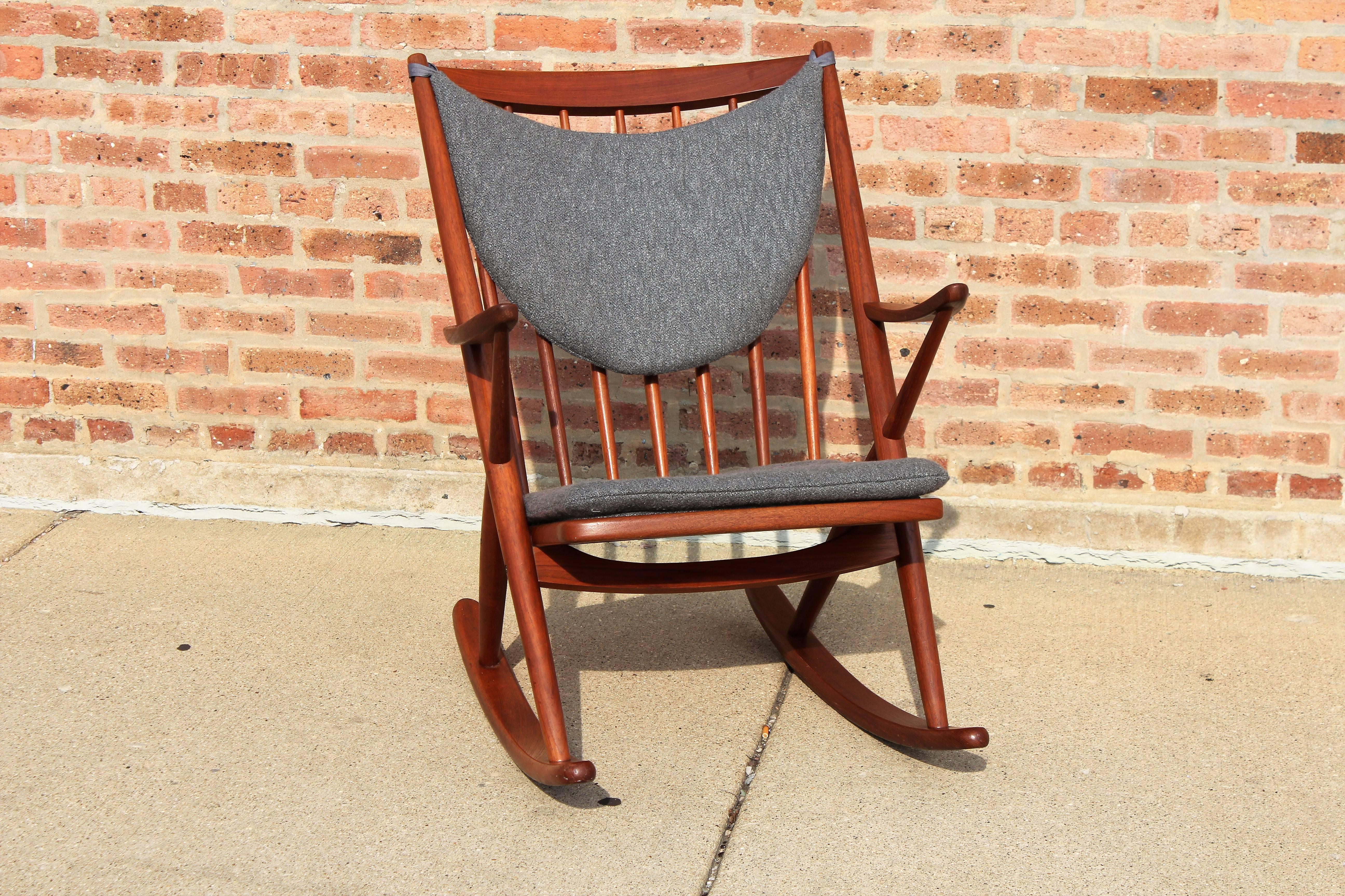 Mid-Century Modern Frank Reenskaug rocker in a lovely rich teak. Newly upholstered in a rich 