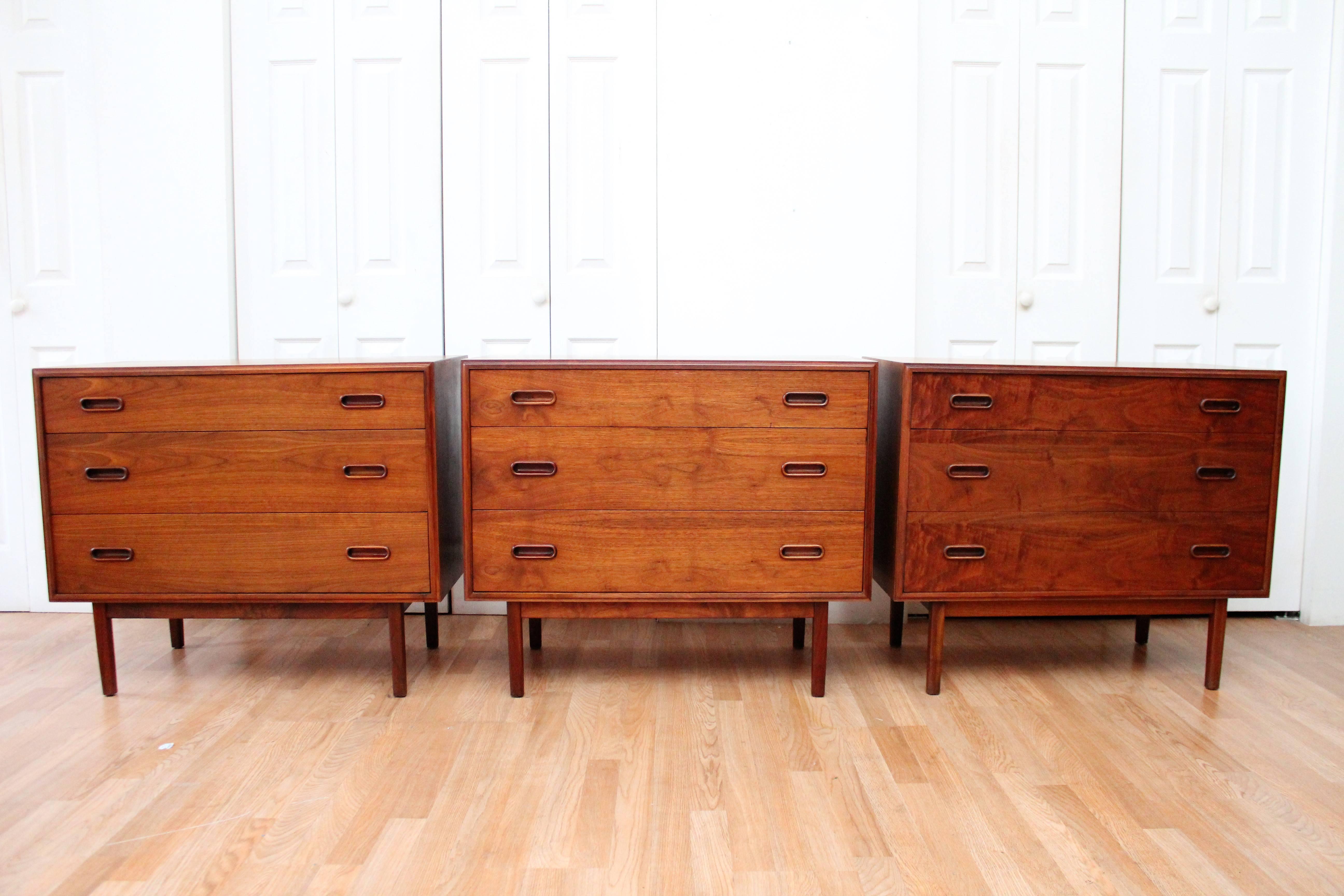 Founders Mid-Century Modern chests cabinets in walnut. Note how the unique handles add a little something extra to the beautiful craftsmanship of these pieces. Purchase per piece or all.