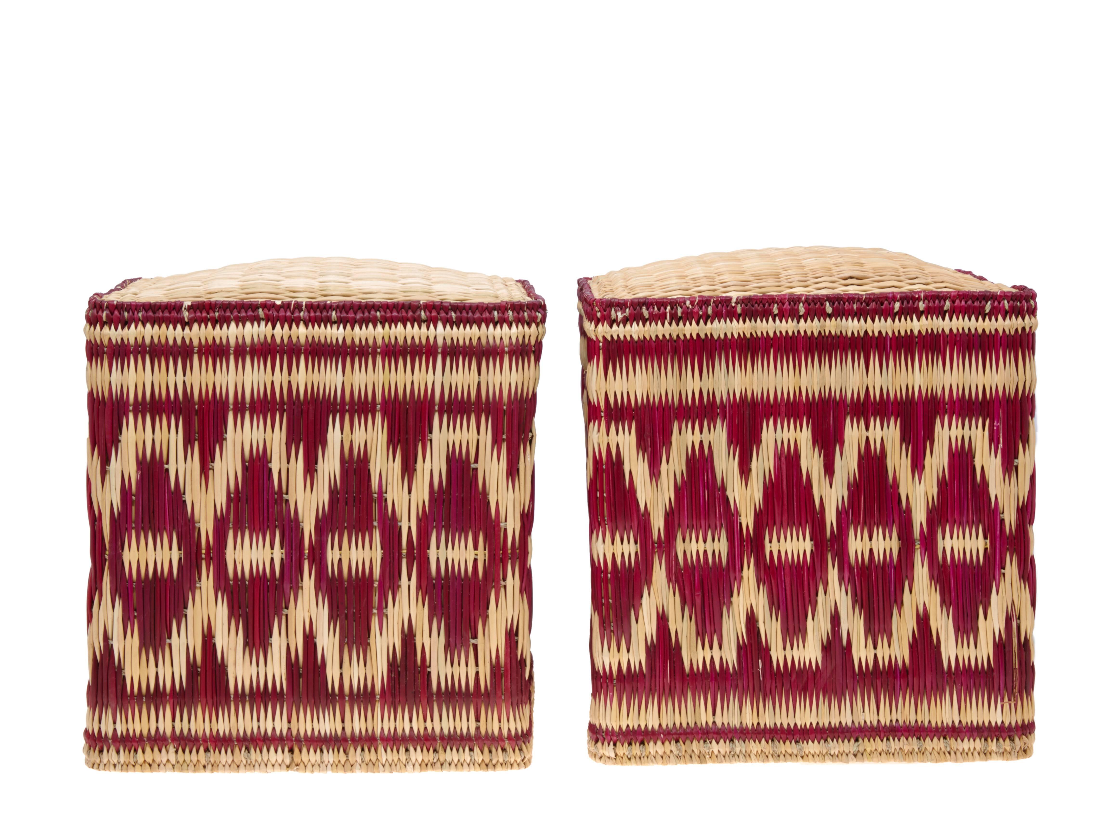 Pair of handwoven wicker stools or small tables with a naturally dyed decorative border.

Price is £800 per pair.