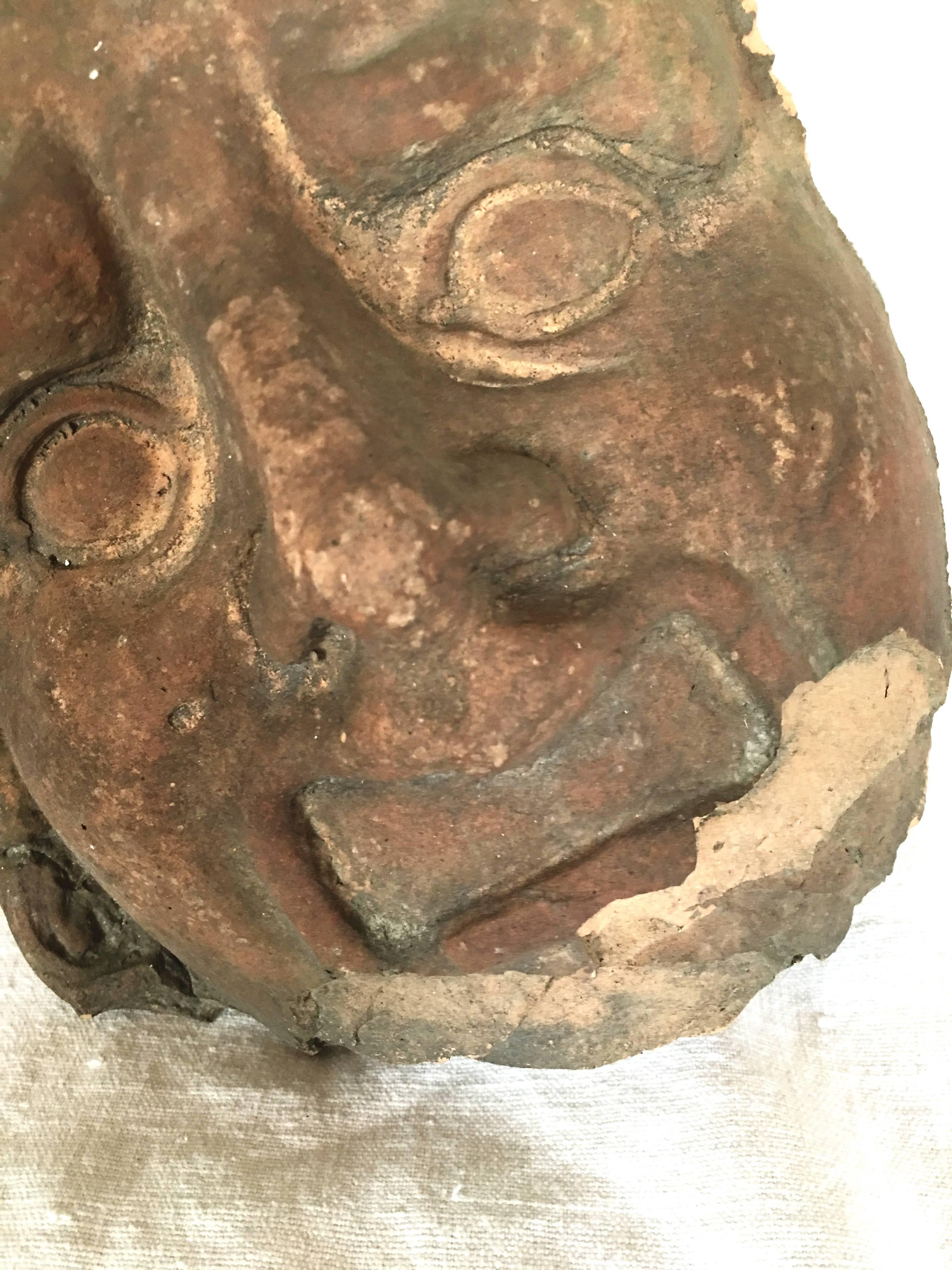 Terracotta fragment of an antique bust.