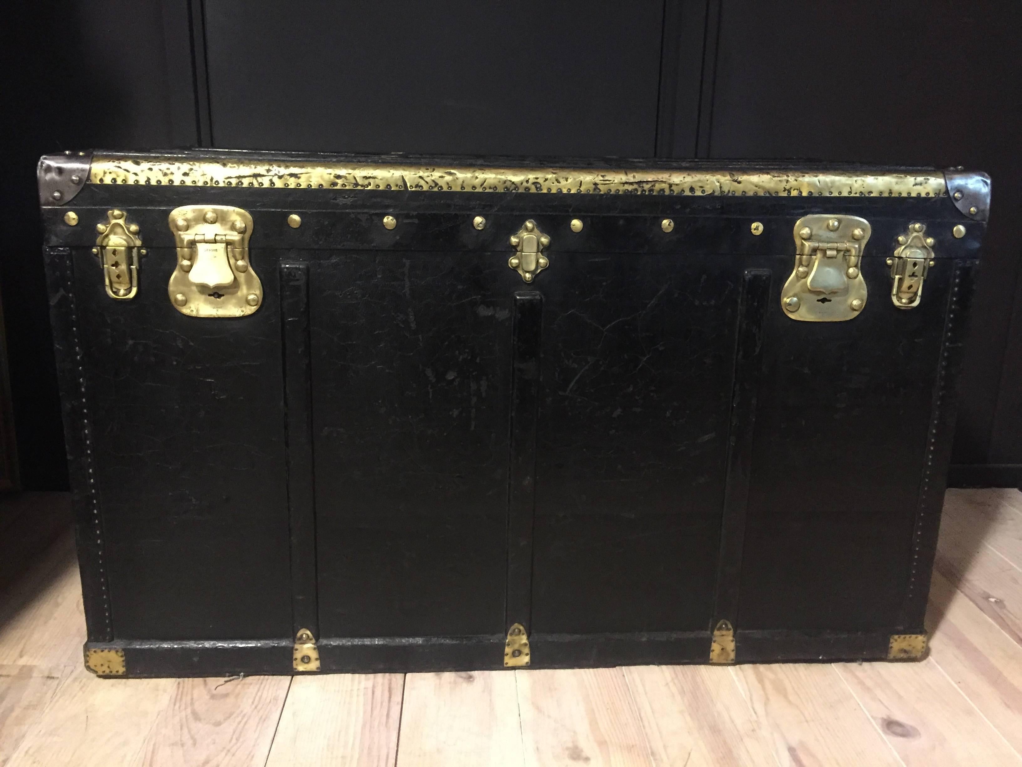 Vintage French steamer trunk. Black leather with brass corners and locks.
Very decorative piece can also be used as a coffee table.
           