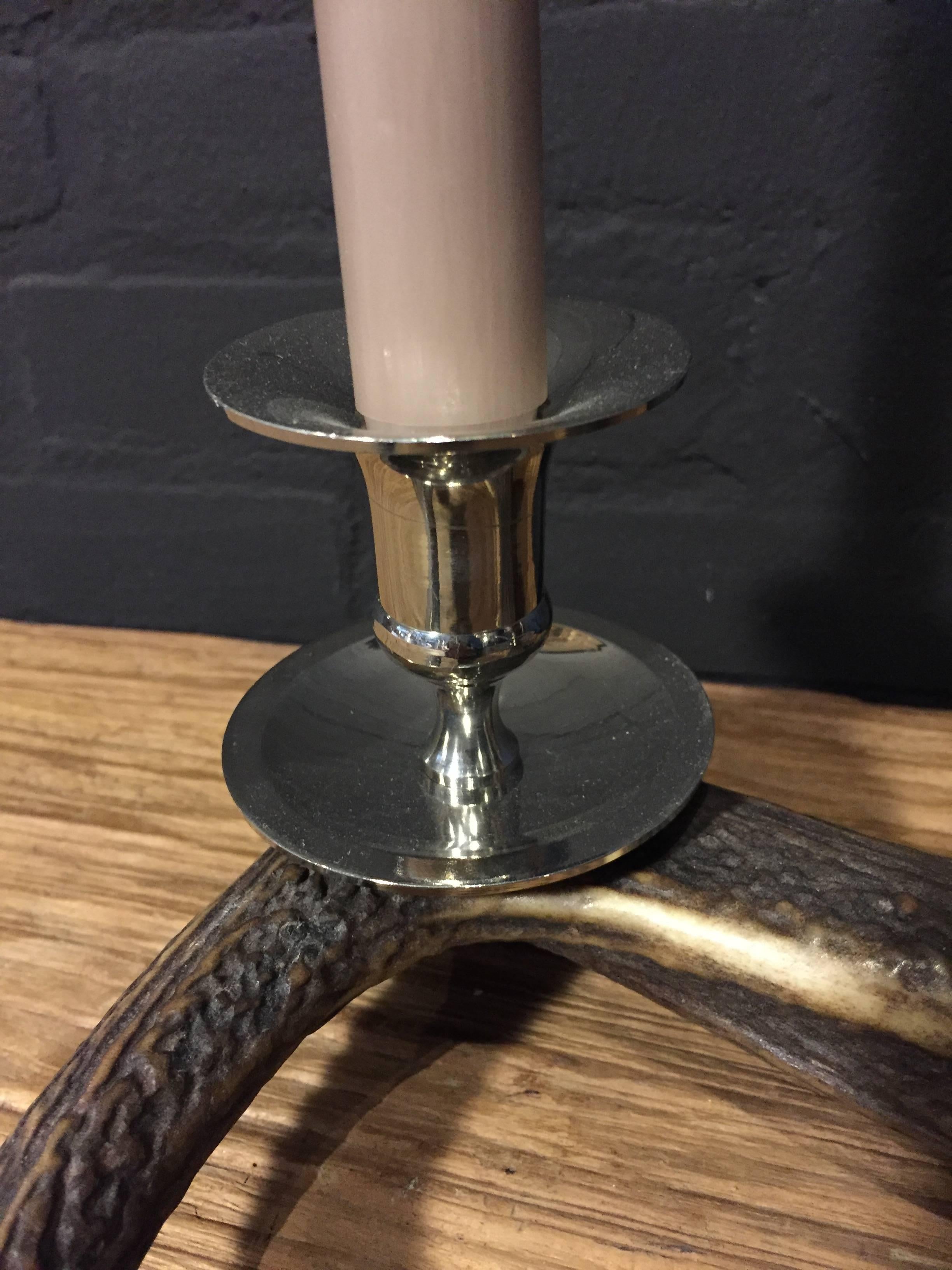 Three light candle. Heavy red deer antler with three shiny chromed candleholders.
