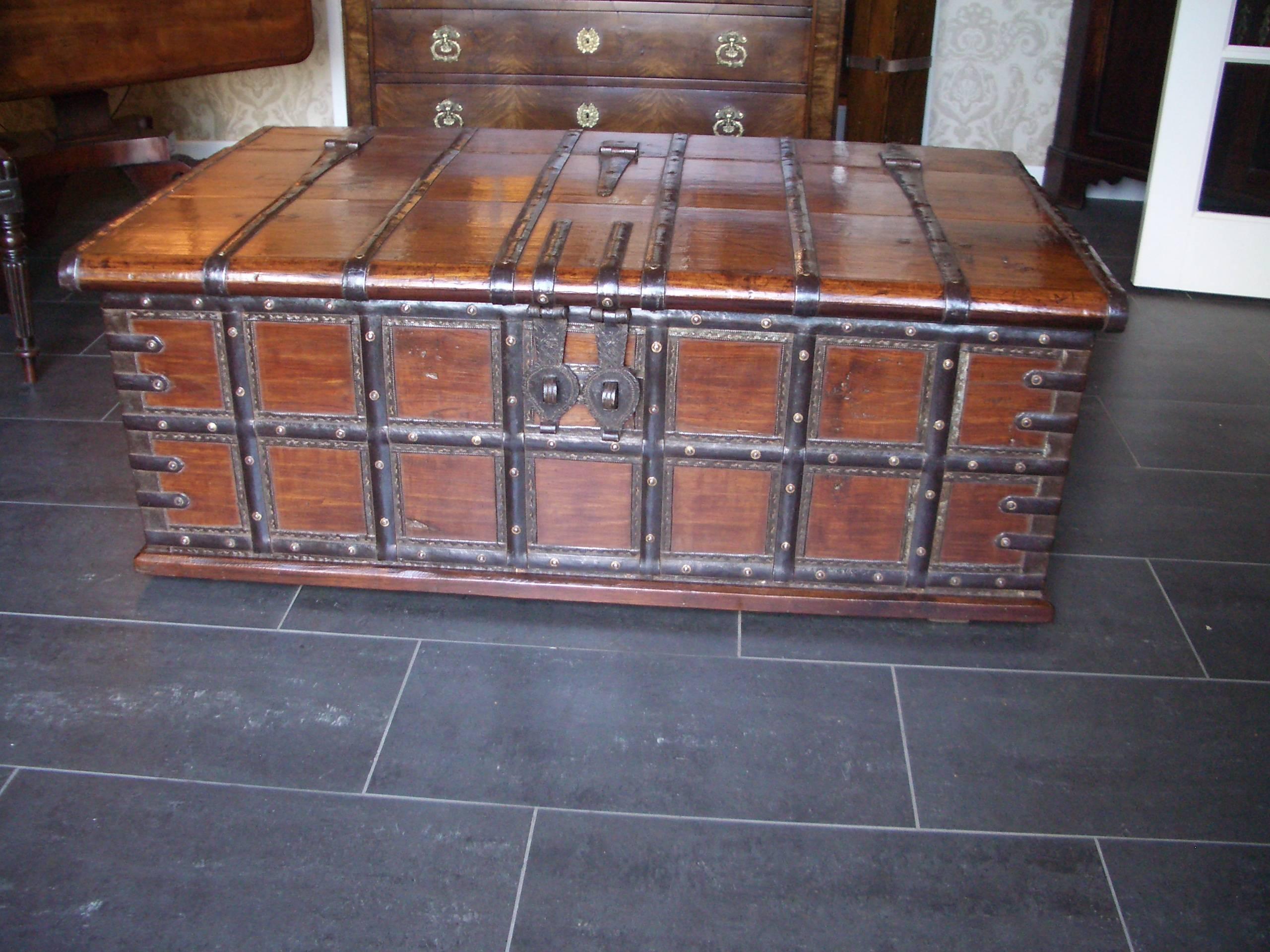 Beautiful antique teak storage box. Beautiful warm tone and tough look through all the ironwork. Very good to use as a coffee table. Originally these boxes were used by Indian families for storage, they were also given as bridal chest.

Origin: