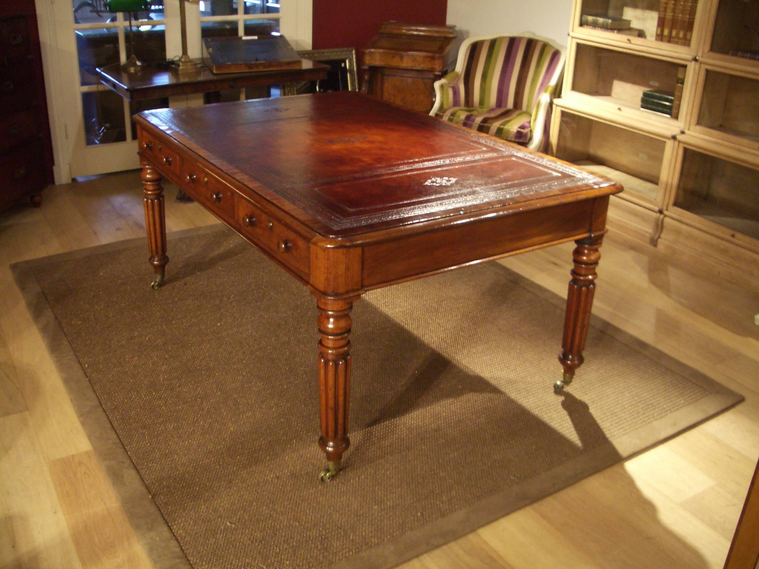 Beautiful antique William IV partners writing desk. The table has three drawers on both sides. Warm mahogany color. Leather is hand-colored brown leather with generous blind tooling. Crossbanded top. Table is in perfect condition. Nice and useful
