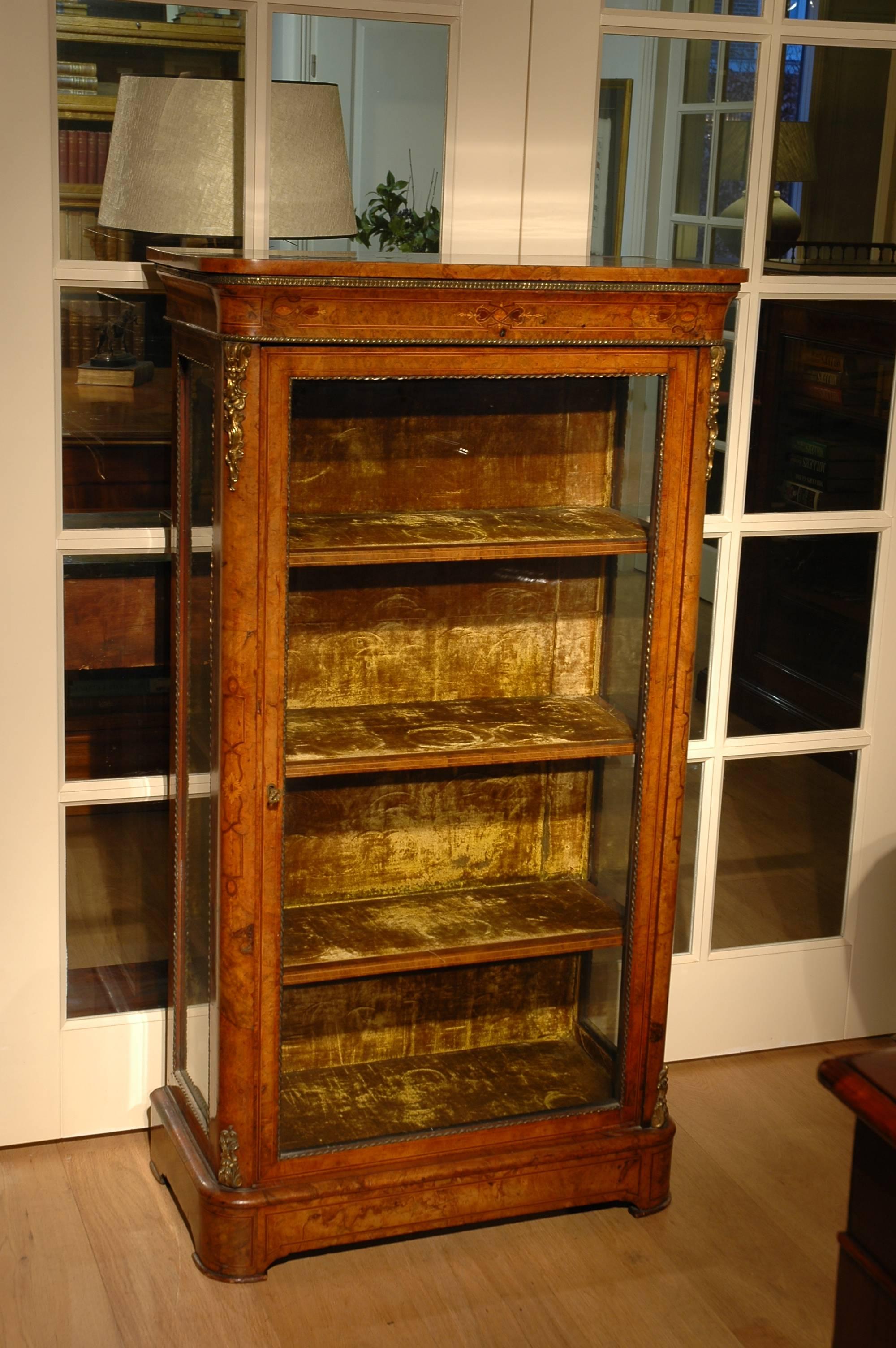 A very high quality burr walnut pier cabinet from the mid-Victorian period. Of fine construction with stunning burr walnut veneers onto a solid mahogany carcas. The cabinet is extensively decorated with crisp ormolu mounts of the highest quality.