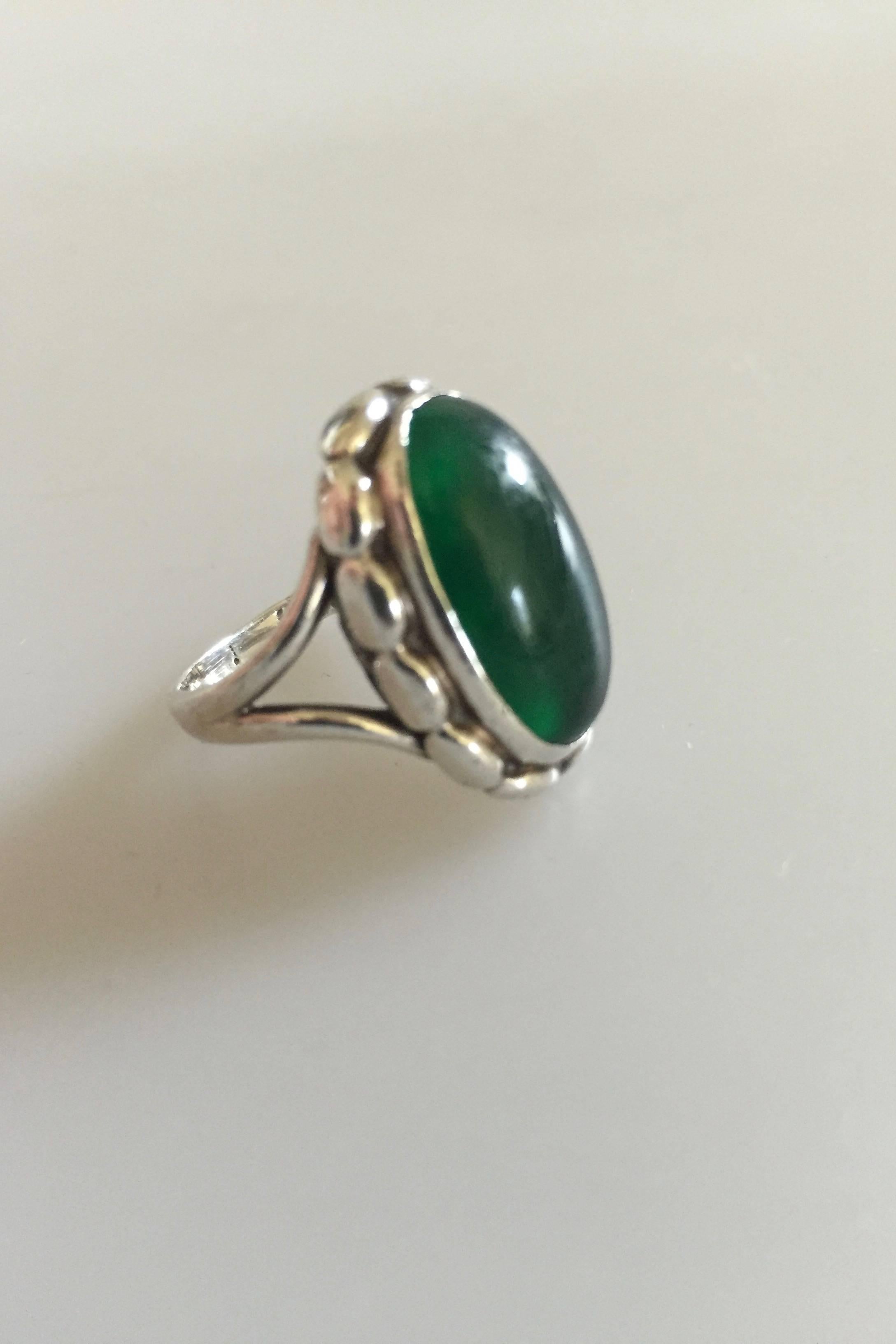 Georg Jensen sterling silver ring #19 with clear green agate. From after 1945. 

Ring size #54.
Stone measures 2 x 1 cm (0 25/32