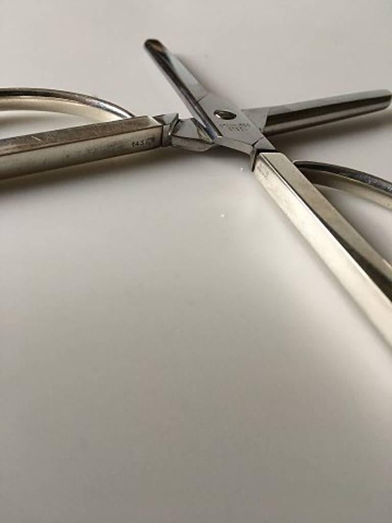 Georg Jensen modern sterling silver and steel scissor no.143. Measures: 13 cm L (5 1/8 inches). Weighs 58 grams.