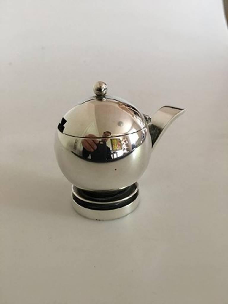 Georg Jensen sterling pyramid sterling silver mustard Jar with blue enamel No 632 Harald Nielsen. Measures 6.5 cm high and is in good condition.  Early hallmarks but flaw to enamel.