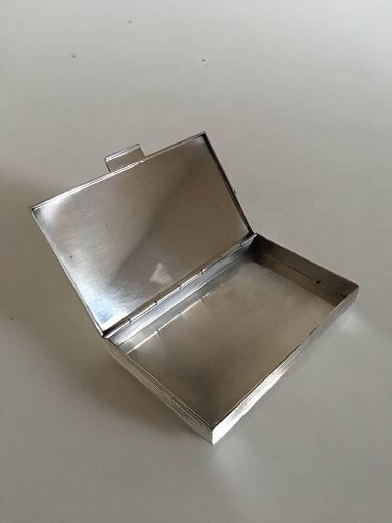 Georg Jensen Sigvard Bernadotte lidded box #712. Measures: 13.5 x 8 cm (5 5/16 in. x 3 5/32 in.). Weighs 262 grams (9.25 oz). In perfect condition.