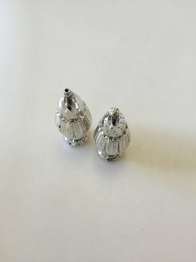 Georg Jensen sterling silver salt and pepper shakers #198 and #198A. Measures 10.5 cm.