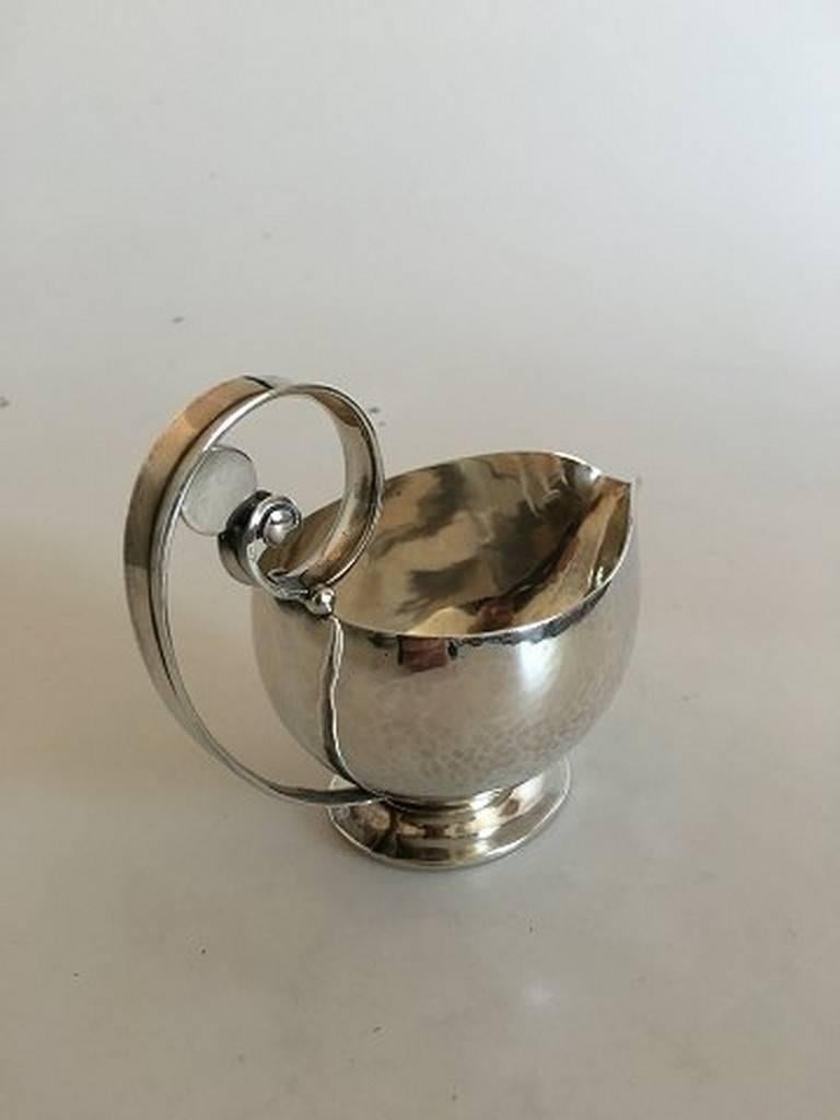 Georg Jensen sterling silver sauce boat or creamer #321A. Weighs 198 g (7 oz.). measures: 11 cm diameter (4 21/64 in). 10.5 cm tall (4 9/64 in.)