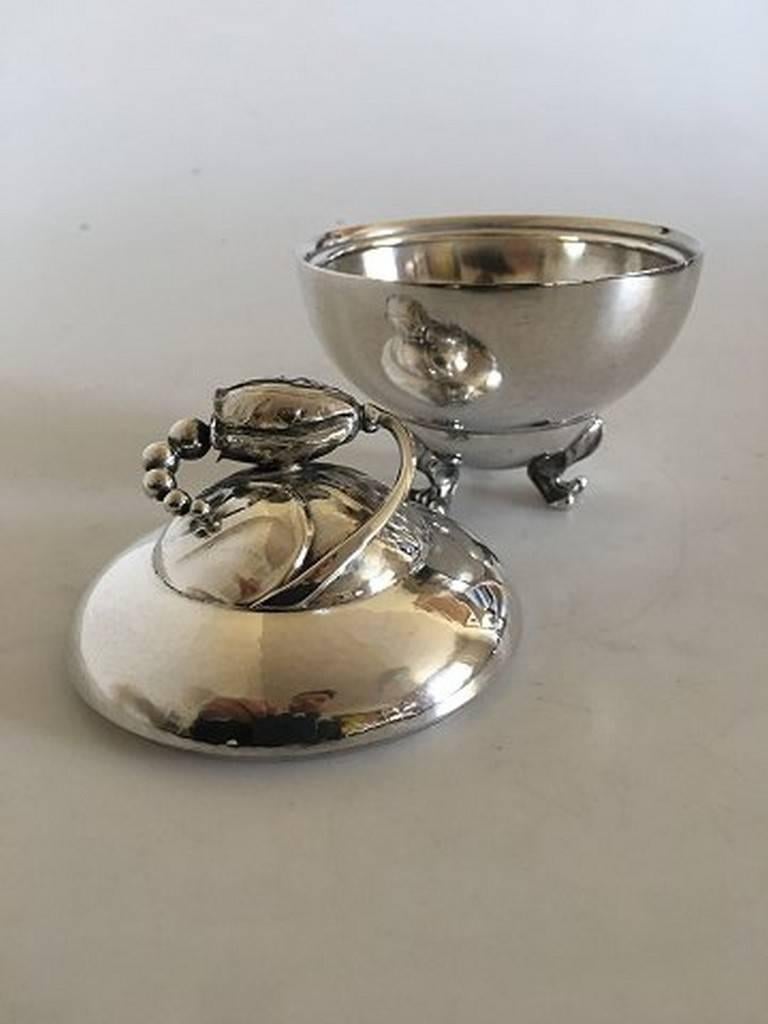 Georg Jensen sterling silver blossom sugar bowl no. 2D. Measures: 12 cm H (4 23/32 inches), 10.4 cm diameter (4 3/32 inches). Weighs 287 grams. Manufactured after 1945.