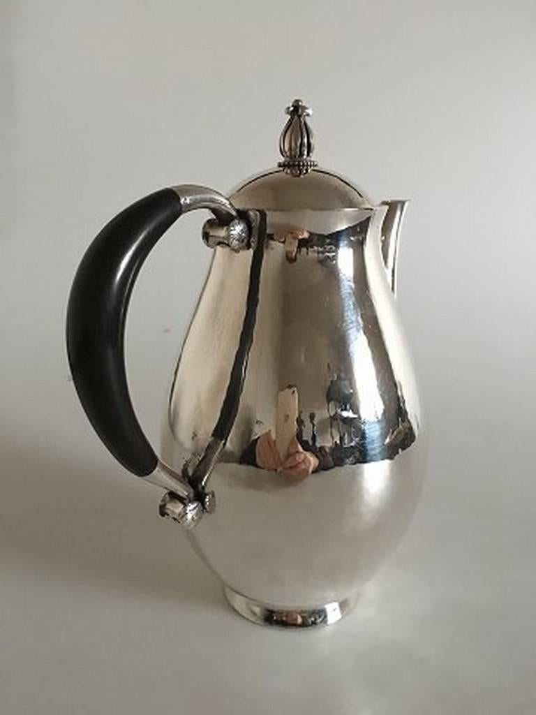 Georg Jensen sterling silver coffee pot #526. Weighs 603 grams (21.25 oz). Measures: 18 cm H (7 3/32 in.). With wooden handle. From 1932-1945. In perfect condition.