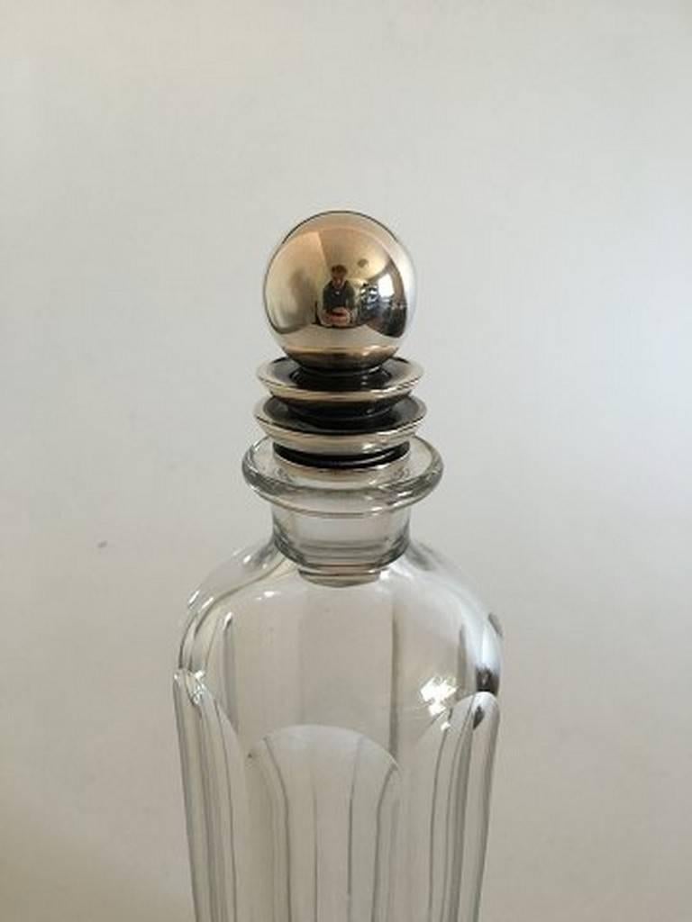 Georg Jensen sterling silver Harald Nielsen lid #206 on baccarat bottle. Measures: 30 cm tall (11 13/16