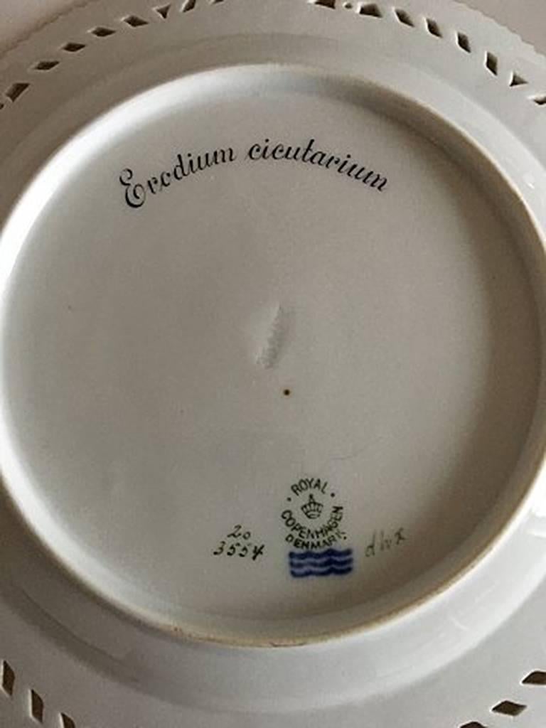 Royal Copenhagen Flora Danica pierced luncheon plate #20/3554. Measures: 23 cm (9 1/16 in). Lantin name: Erodium Cicutarium. With old mark from 1923-1934.