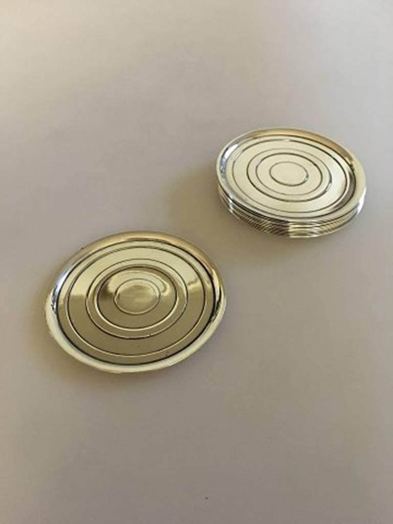 Hans Hansen sterling silver coasters set of 12 by Karl Gustav Hansen. Measures: 7.8 cm and is in good condition.