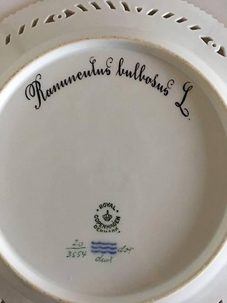 Royal Copenhagen Flora Danica luncheon plate with pierced border #3554. Latin name: Ranunculus Bulbosus. Measures: 23 cm (9 1/16 inches). 1st Quality. In perfect condition.