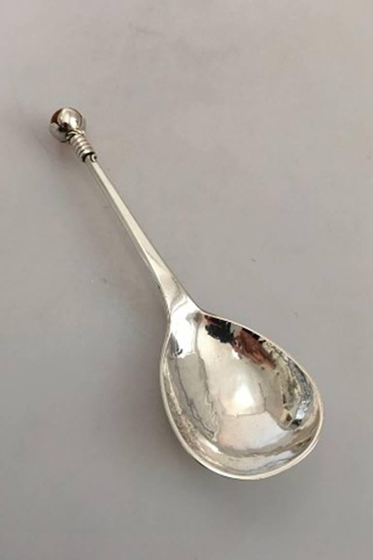 Mogens Ballin silver compote spoon ornamented with amber stone.

Measures: 17.5 cm L (6 57/64