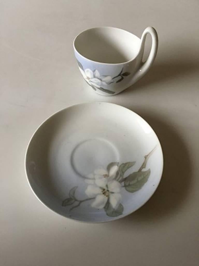 Royal Copenhagen Art Nouveau small high handled cup and saucer no. 1242/4. The cup and saucer are in nice whole condition. Measures: Cup measures 5.2 cm H (8 cm measured to the top of the handle), 2nd quality.