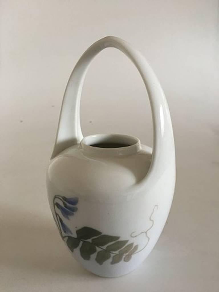 Royal Copenhagen Art Nouveau vase with handle #364/29. With flower Motif. Measure: 19 cm H (7 31/64 in). In nice whole condition, 1st quality.