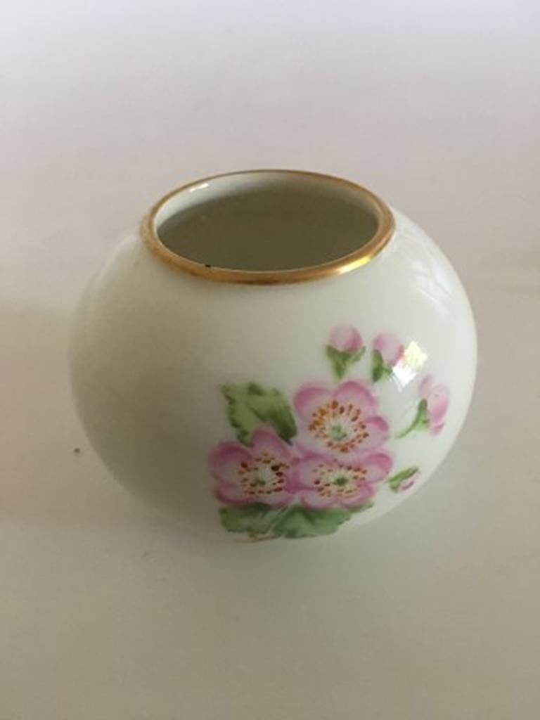 Royal Copenhagen miniature vase with roses in over glaze. Measures: 6 cm H. In nice condition.