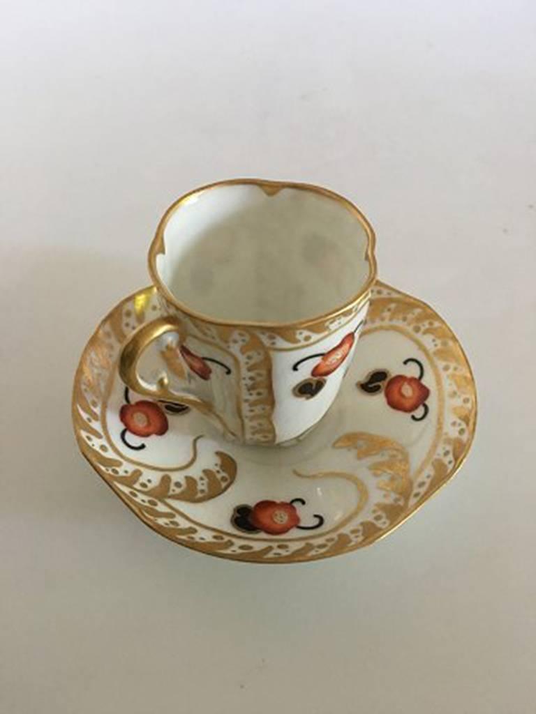 Bing & Grondahl hand-painted cup and saucer. Cup measures 7 cm H (2 3/4 in). Saucer 12 cm diameter. In very nice condition.
