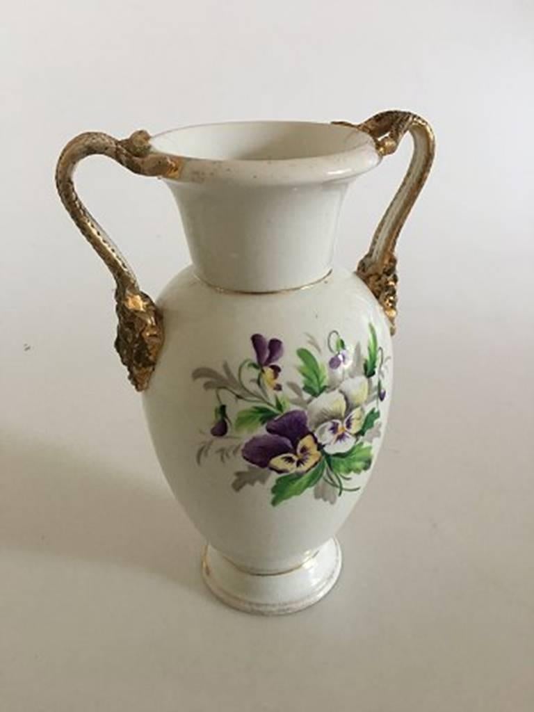 Bing & Grondahl early vase with snake handles.

Measures 23cm / 9 in. In good condition, has wear and one handle has a hairline.