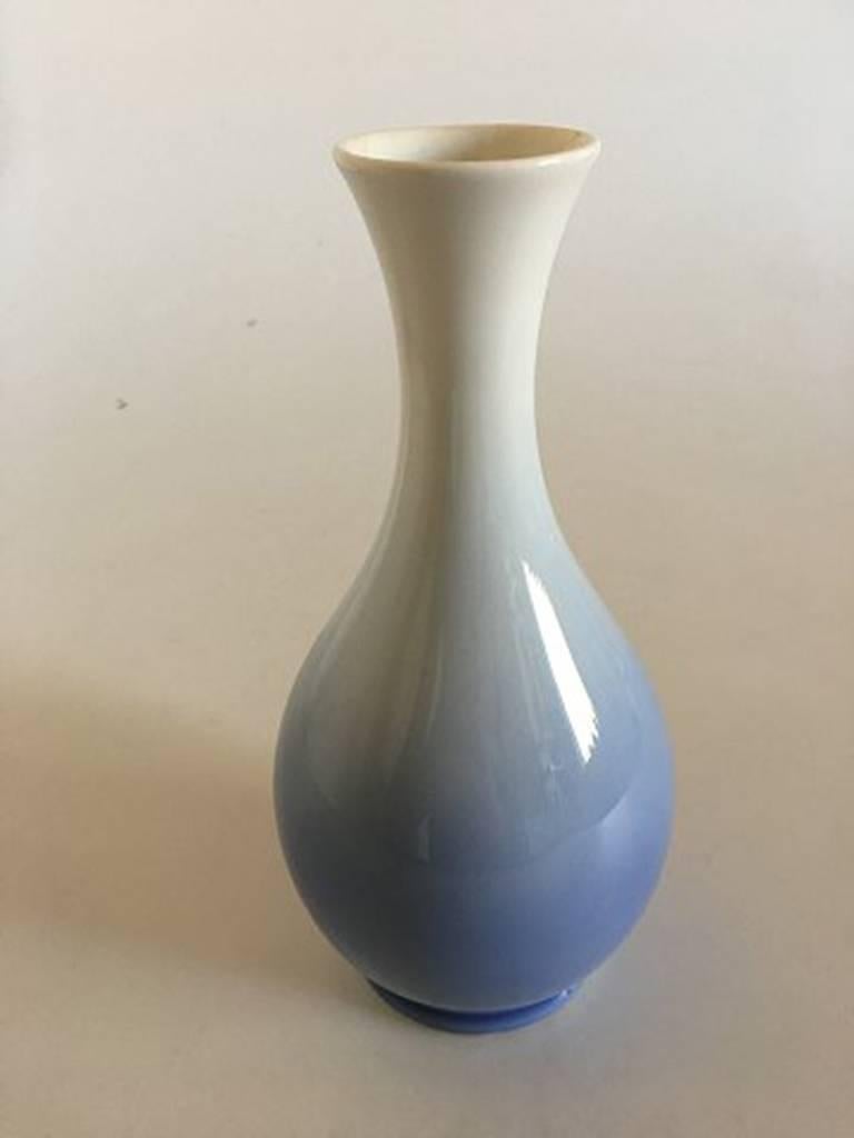 Royal Copenhagen vase #53/57 with flower motif. Measures: 22 cm H (8 21/32 in). 1st quality in nice and whole condition.