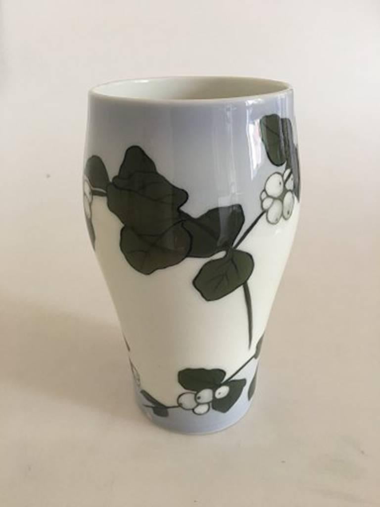 Royal Copenhagen vase #204/65A with white symphoricarpos. Measure: 21 cm H (8 17/64 inches). 1st quality but has a small chip but the foot (look at picture).
