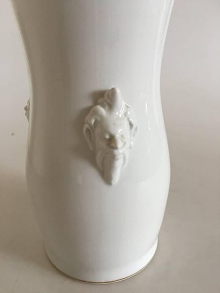 Royal Copenhagen Art Nouveau vase with faces #21/81. Measures: 26.7 cm and is in good condition.