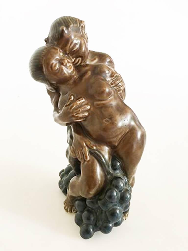 Kai Nielsen stoneware figurine no. 23 of pan with woman and grapes. Measures: 23 cm H (9 1/16 in) in perfect condition.