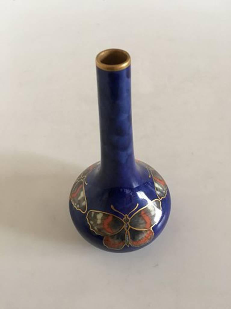 Royal Copenhagen Art Nouveau vase with butterfly, gold decoration #1638/202. Measures 14.5 cm.