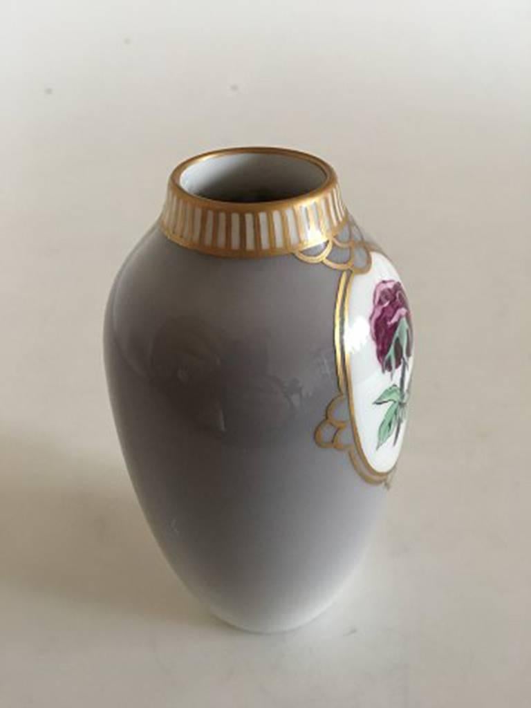 Royal Copenhagen Art Nouveau vase #239 with gold. Measures 13.5 cm and is in good condition.