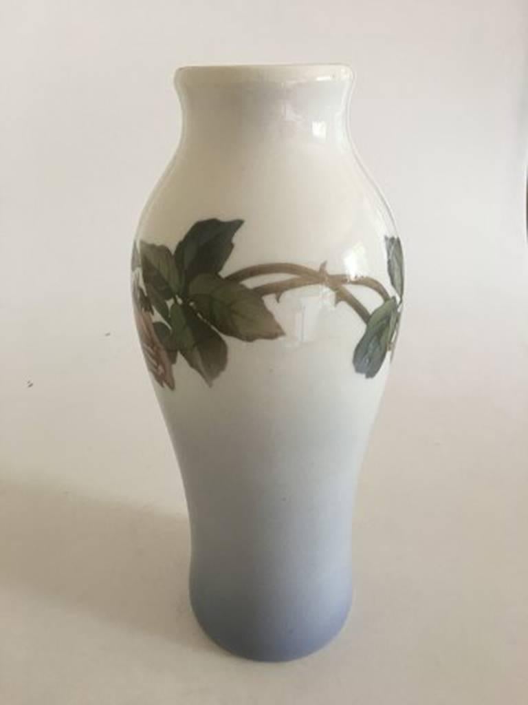 Royal Copenhagen vase #1393/244 with rose motif. Measure: 33 cm H (12 63/64 in). 2nd Quality, in good condition.