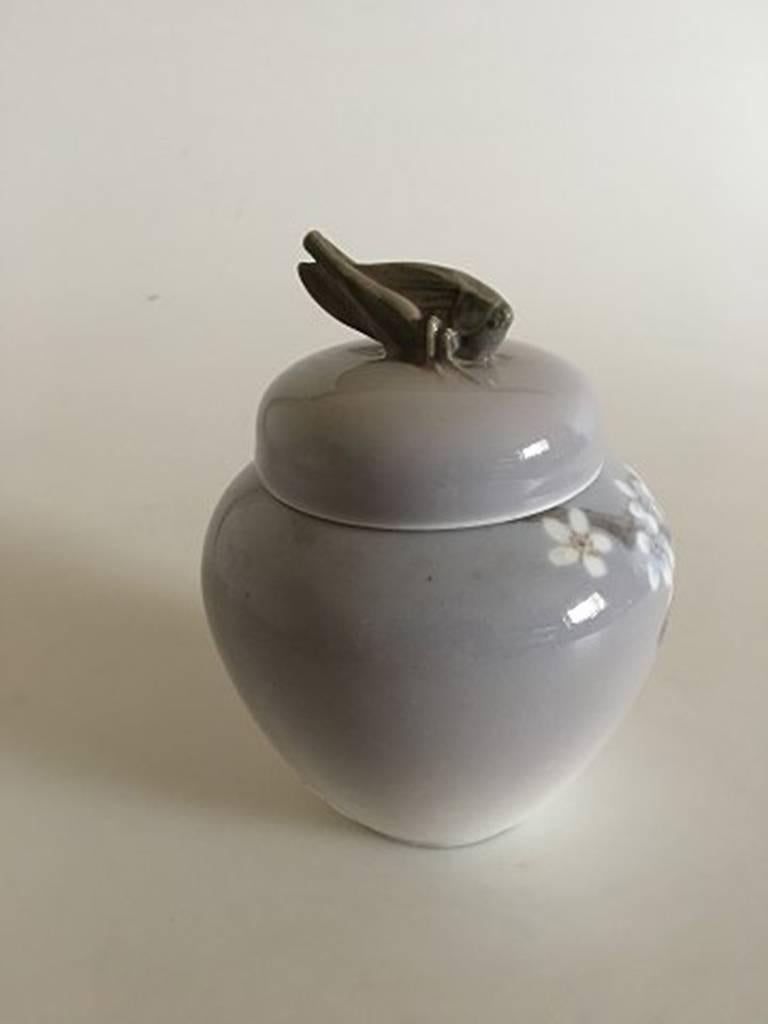 Royal Copenhagen Art Nouveau lidded vase with grasshopper and butterfly #1528/254. Measures 13 cm and is in perfect condition.