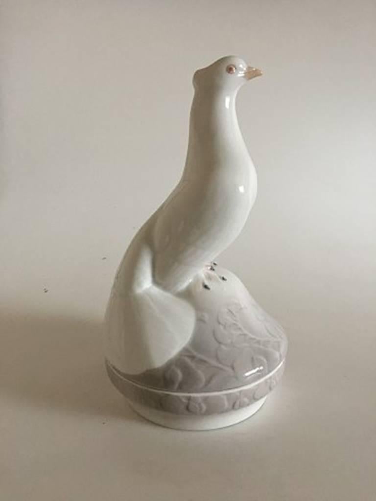 Royal Copenhagen lidded dish with pigeon #368. Rare bowl in perfect condition, marked as first quality. Measures 28 cm high.
