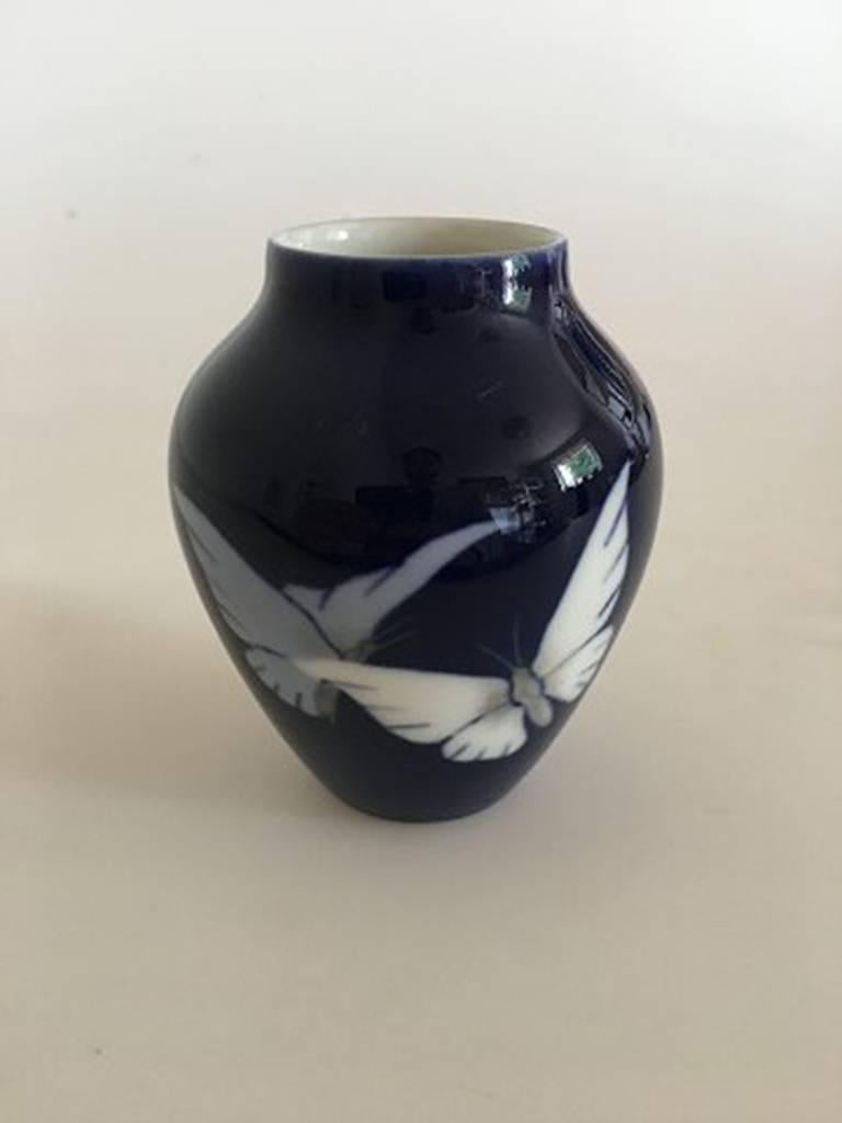 Bing & Grondahl Art Nouveau vase with butterfly #1676/12. Measures 9 cm and is in good condition.