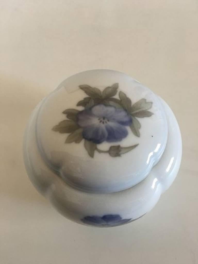 Royal Copenhagen Lidded Jar #1763/424 with Blue Flower Motif

Royal Copenhagen Lidded Jar #1763/424 with Blue Flower Motif. 1st Quality. Measures 10 x 12 cm (3 15/16 in x 4 23/32 in). In nice and whole condition.