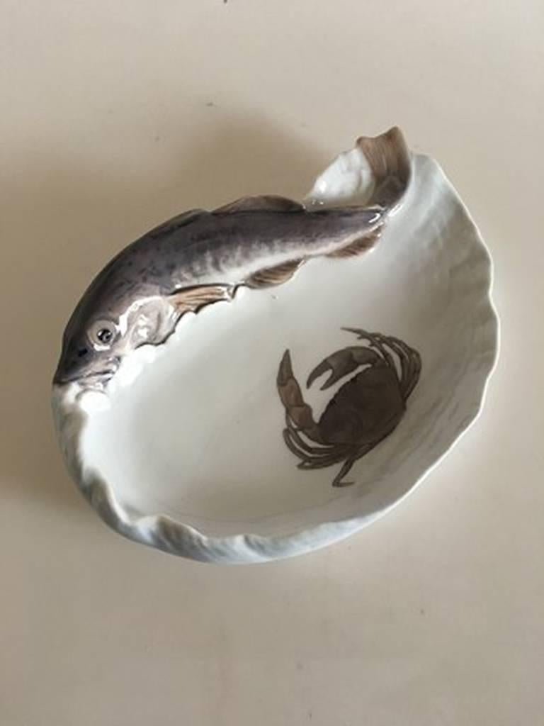 Royal Copenhagen Art Nouveau bowl or dish with a cod #480.

Measures: 28 cm x 19 cm. (11 in x 7 1/2 inches). Marked as 1st quality.