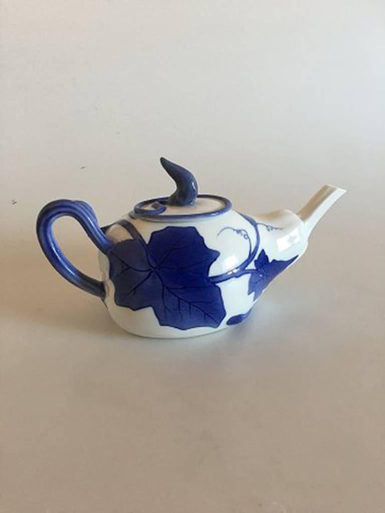 Royal Copenhagen Art Nouveau tea pot #506 (Dinnerware No. 4) Measures: 12 x 23 cm (4 23/32 in x 9 1/16 in). The tea pot is in perfect condition, but the lid has a reparation.