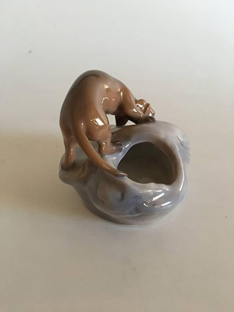 Royal Copenhagen Art Nouveau dog on mound #693. Measures 11 cm / 4 1/3 in. high and in perfect condition and 1st quality.