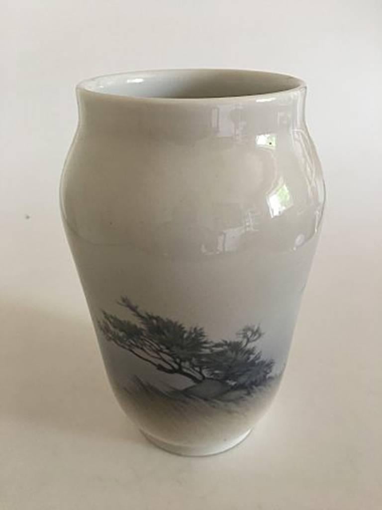 Royal Copenhagen vase #2253/1217 with landscape motif with two white ducks. Measure: 25 cm H (9 27/32 in). 1st Quality. In perfect condition.