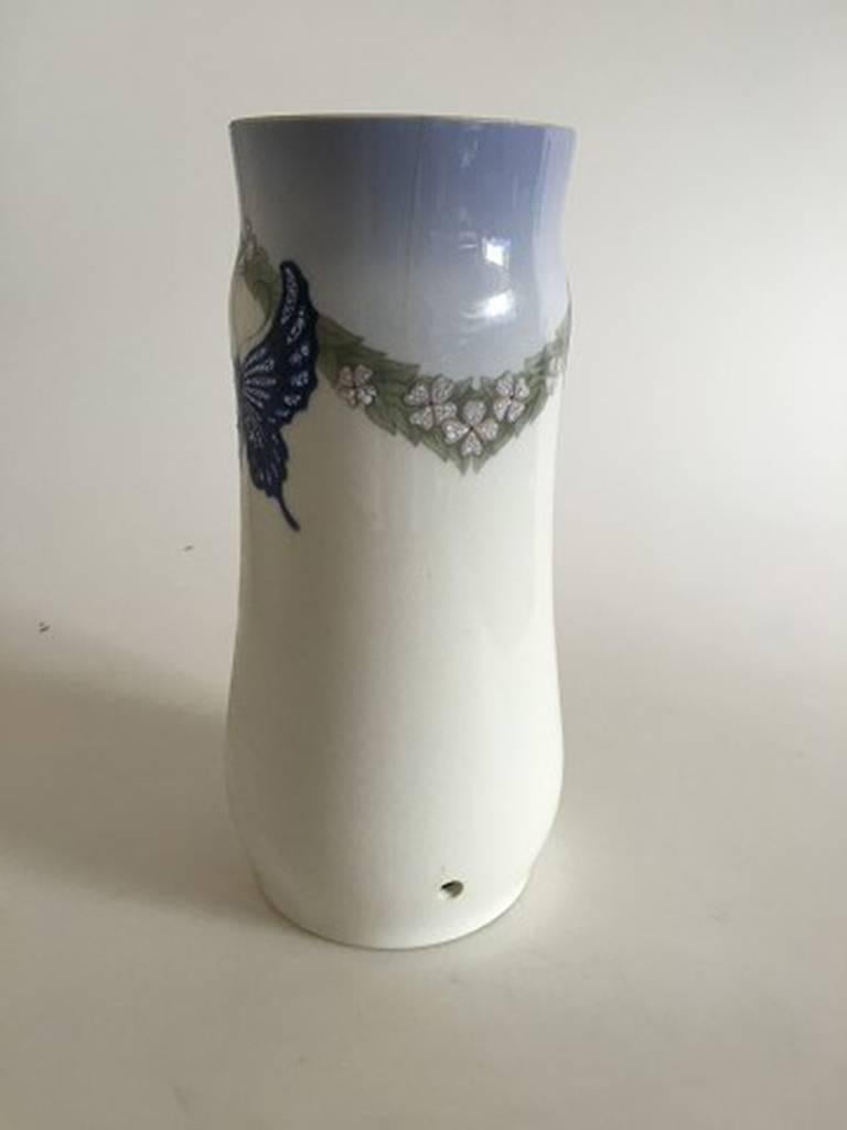 Royal Copenhagen Art Nouveau vase with butterfly 1395/76
The decoration is done in a thick enamel paint. Very rare.
The vase measures 27.5 cm tall (10 53/64 in.)
The vase is drilled for a lamp and has a hairline.