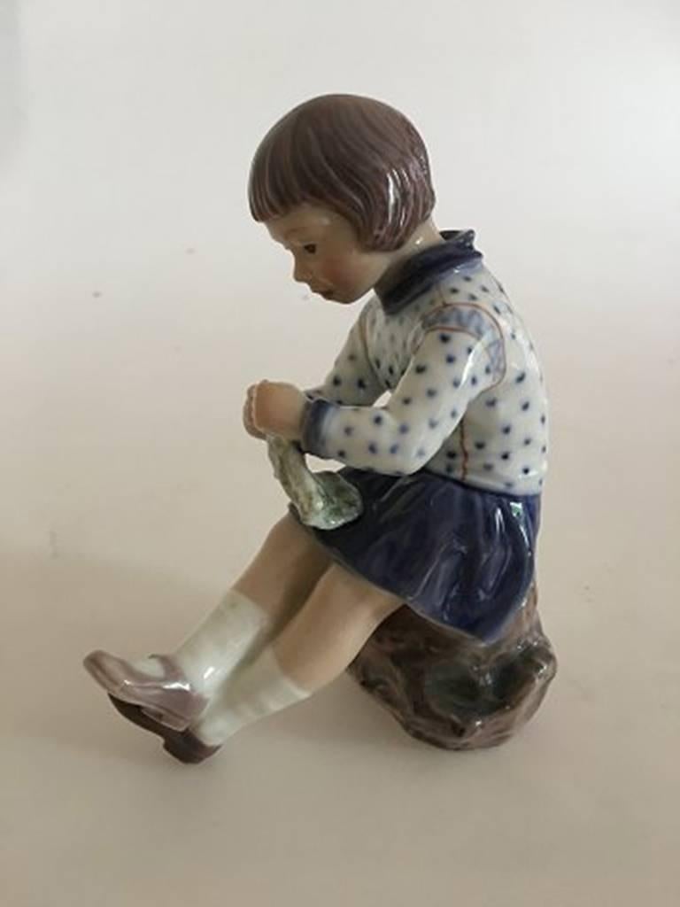 Dahl Jensen porcelain figurine of knitting girl No. 1197. Measures: 15 cm H (5 29/32 in). 1st quality, In perfect condition.