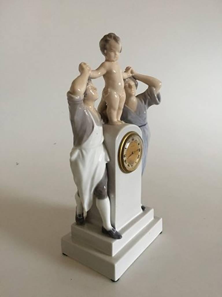 Royal Copenhagen Art Nouveau clock with man, woman and child by Christian Thomsen. Measures 25 cm high and is in perfect condition.