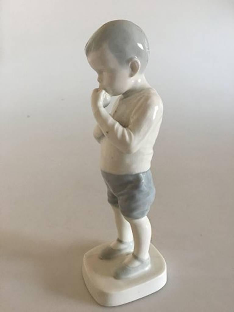 Bing & Grondahl figurine boy Peter #1696. Measures: 19 cm and is in good condition.