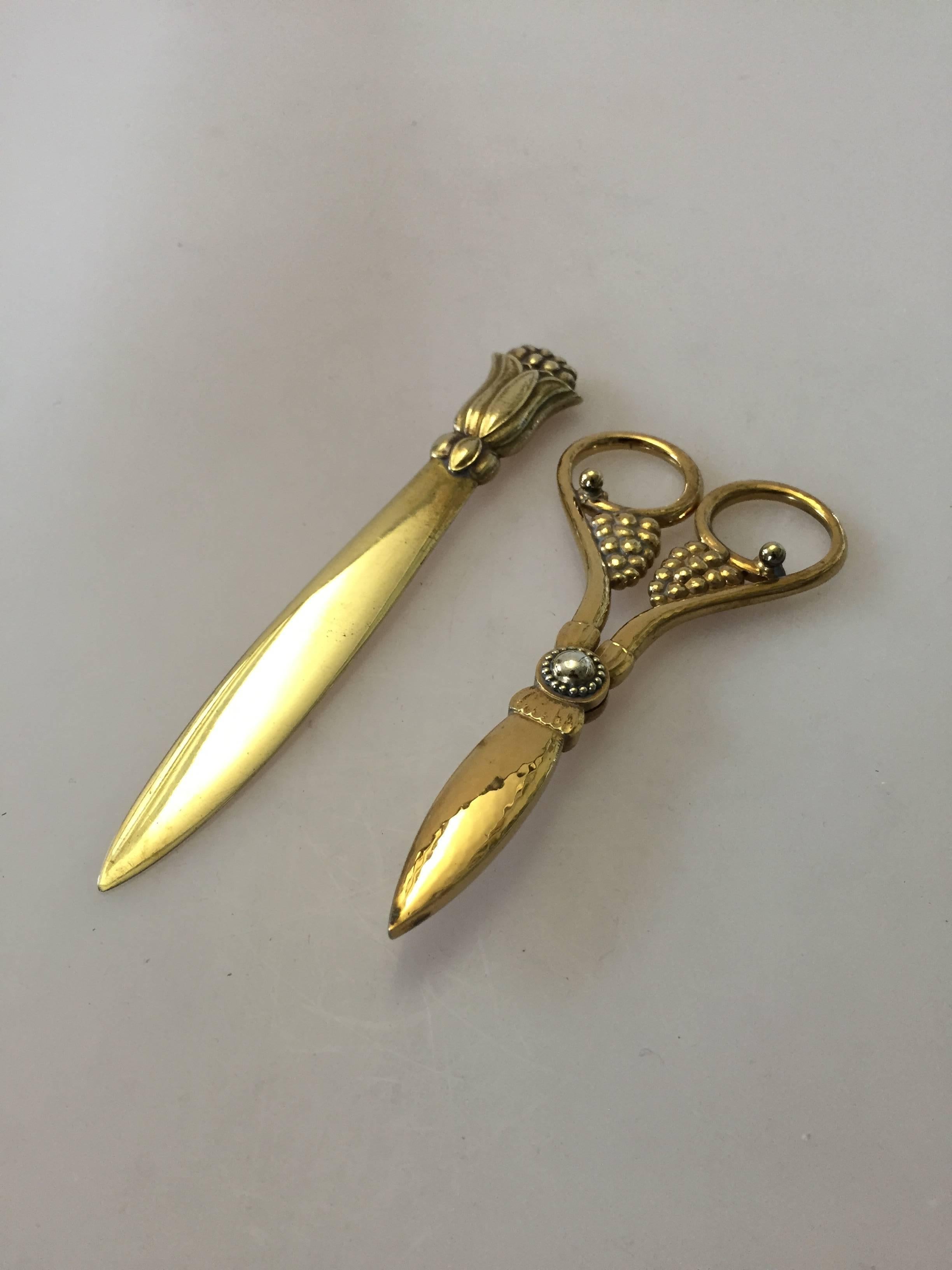 Georg Jensen copper grape scissor and letter knife.

A beautiful pair of scissor and letter knife made in copper. Done by employee at Georg Jensen. 

Knife measures 15.6 cm / 6 9/64