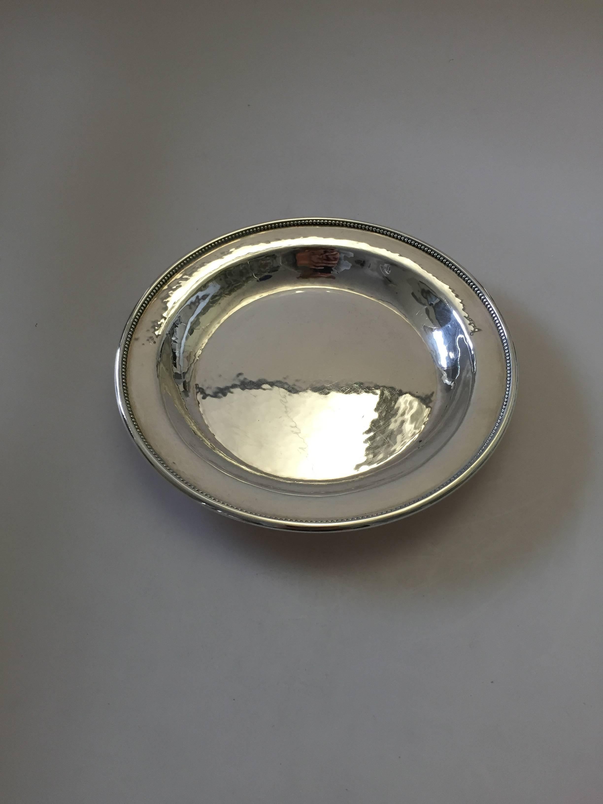 Georg Jensen sterling silver dish. Measures 17.5 cm. Dates 1930-1940 and is in good condition. 

Georg Jensen (1866-1935) opened his small silver atelier in Copenhagen, Denmark in 1904. By 1935 the year of his death, he had received world acclaim