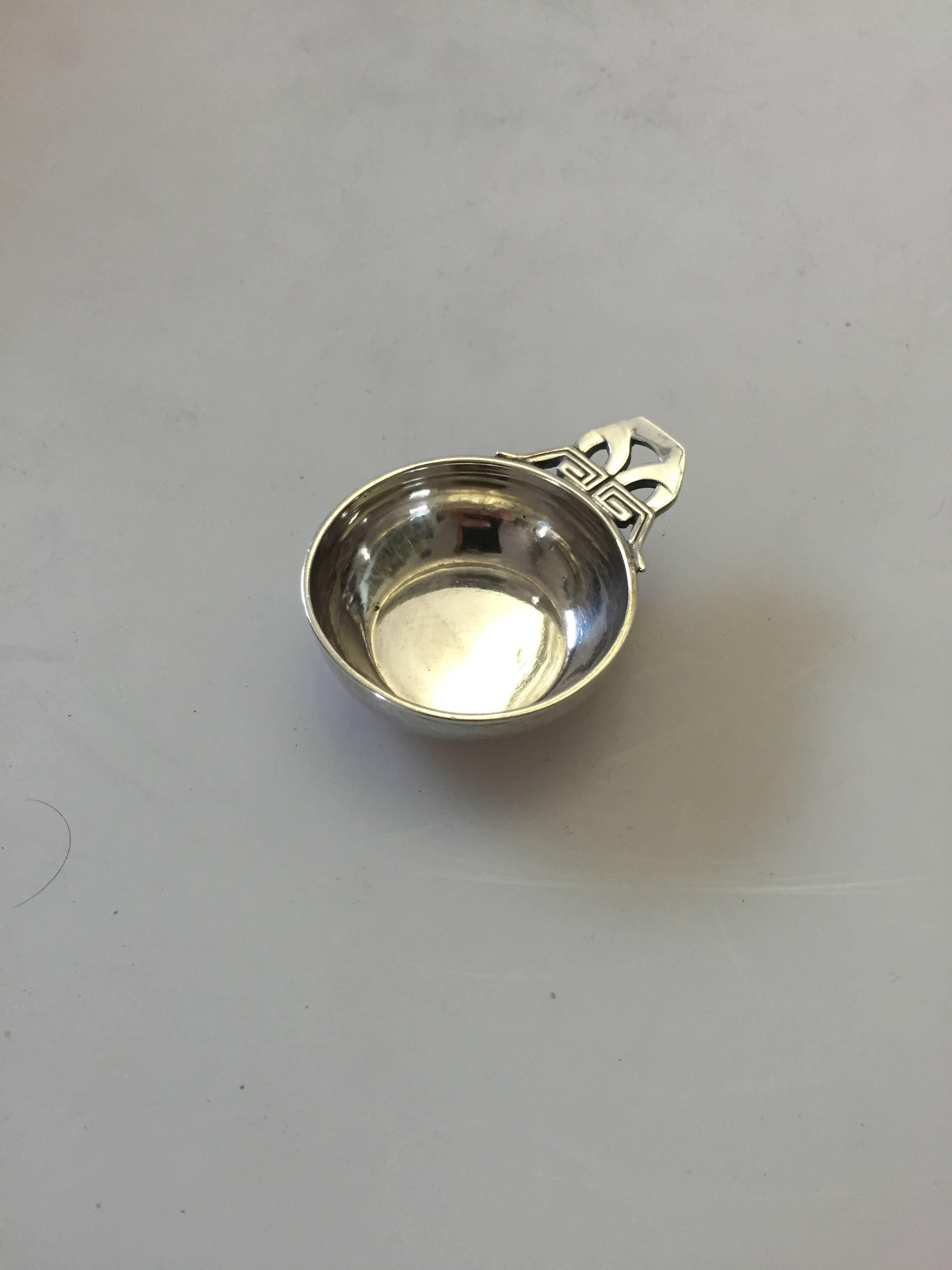 Georg Jensen sterling silver salt dish #402. The salt dish measures 5.5 cm and is in a good condition.

Georg Jensen (1866-1935) opened his small silver atelier in Copenhagen, Denmark in 1904. By 1935 the year of his death, he had received world